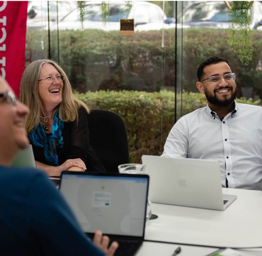 top digital agency for charities employees looking and laughing