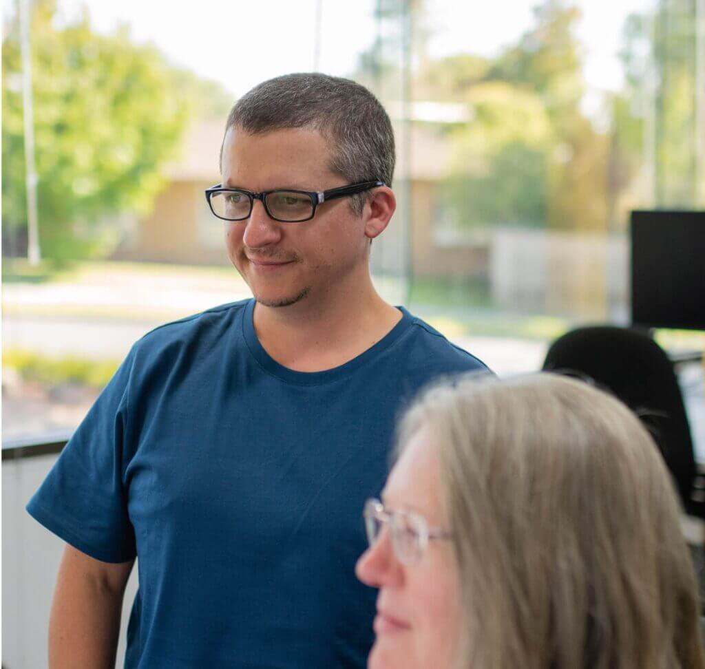 Heartburst employee looking at computer - top digital agency for not for profits